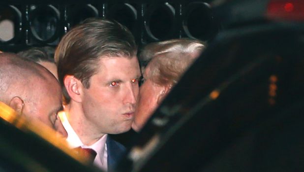 President-elect Donald Trump right kisses his son Eric farewell after dining at the 21 Club in New York on Tuesday