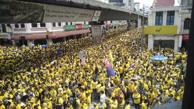 Protesters occupy a street during a rally in downtown Kuala Lumpur Malaysia Saturday Nov. 19 2016. Tens of thousands of yellow-shirt protesters rallied S