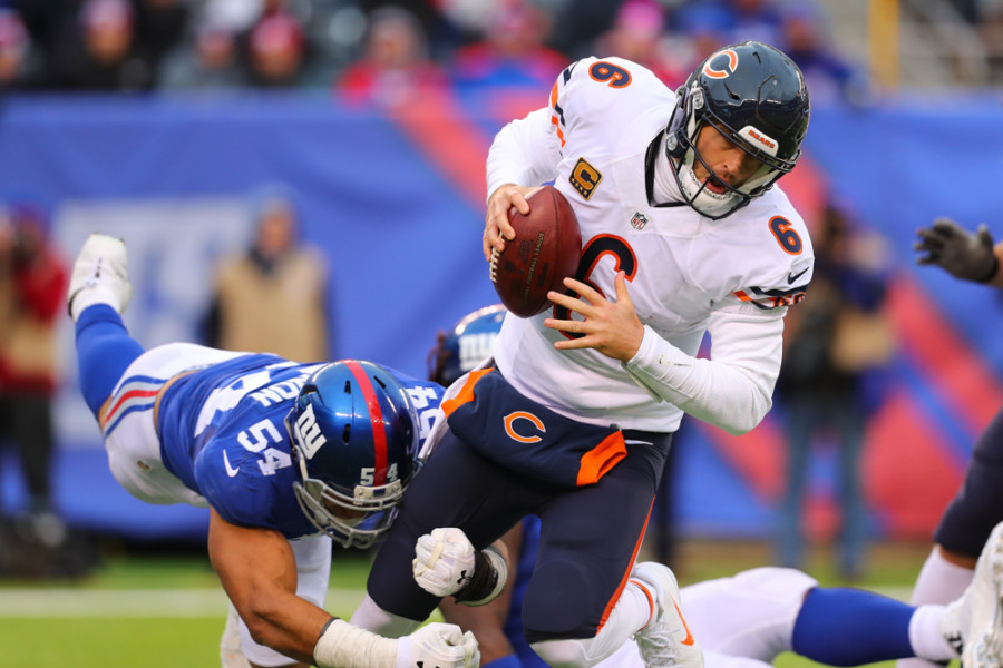 EAST RUTHERFORD NJ- NOVEMBER 20 Chicago Bears quarterback Jay Cutler gets sacked by New York Giants defensive end Olivier Vernon during the fourth quarter of the National Football League game between the New York Giants and the Chicago Bears