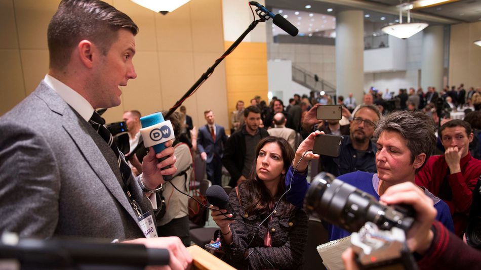 Richard Spencer left talks to the media at an Alt Right conference hosted by the National Policy Institute in Washington