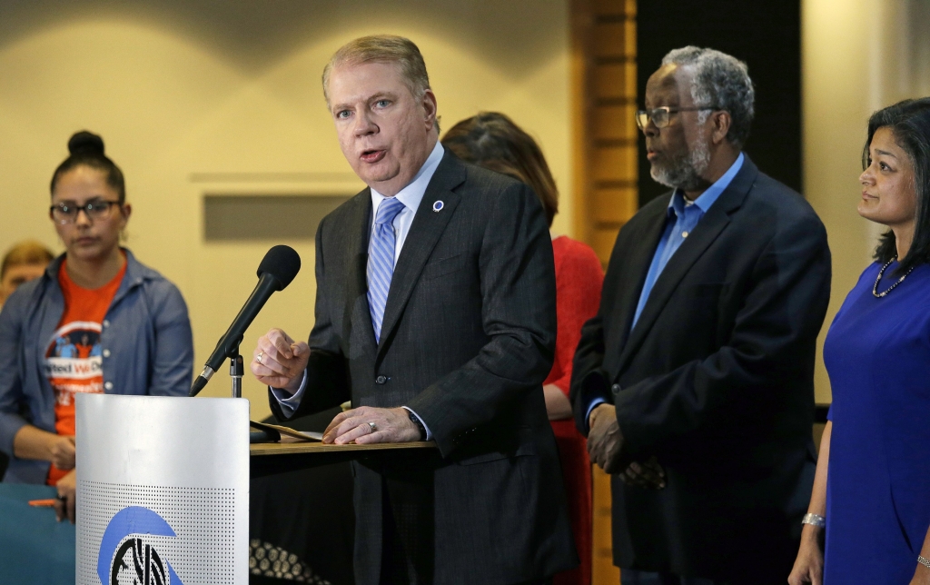 Seattle Mayor Ed Murray second left speaks at a post-election event of elected officials and community leaders at City Hall in Seattle. Leaders in Seattle San Francisco and other so-called'sanctuary cities say they