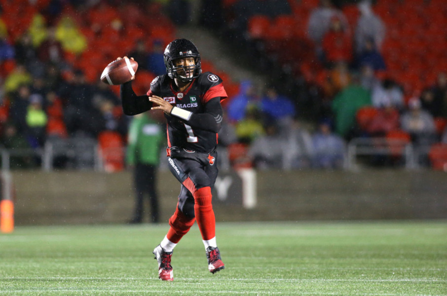 Henry Burris of the Ottawa Redblacks prepares to throw the ball downfield against the Hamilton Tiger Cats in Canadian Football League action at TD Place Stadium in Ottawa Canada. The Hamilton Tiger Cats defeated the Ottawa Redblac