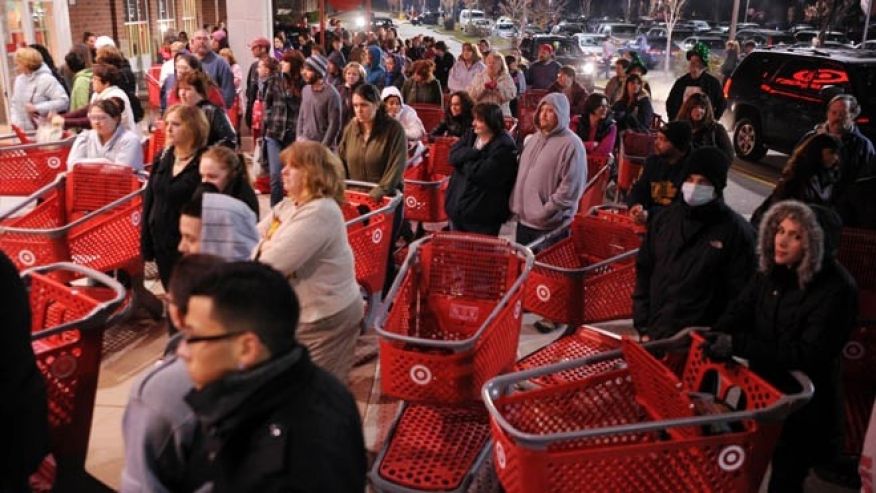 FILE- Nov. 25 2011 A crowd of shoppers wait outside the Target store in Lisbon Conn. before the store opens for Black Friday shopping at midnight