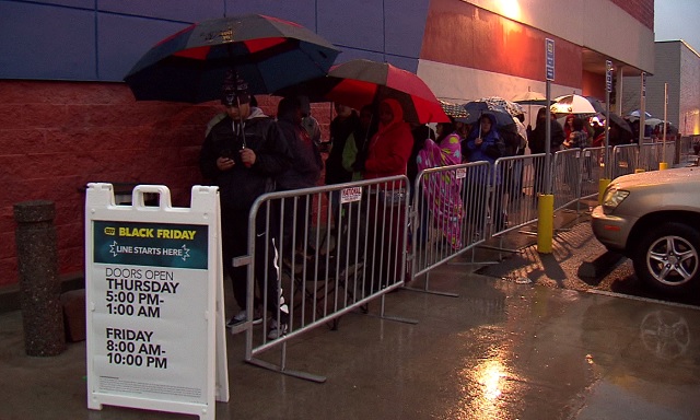 Shoppers wait in line for Best Buy to open on Thanksgiving Day