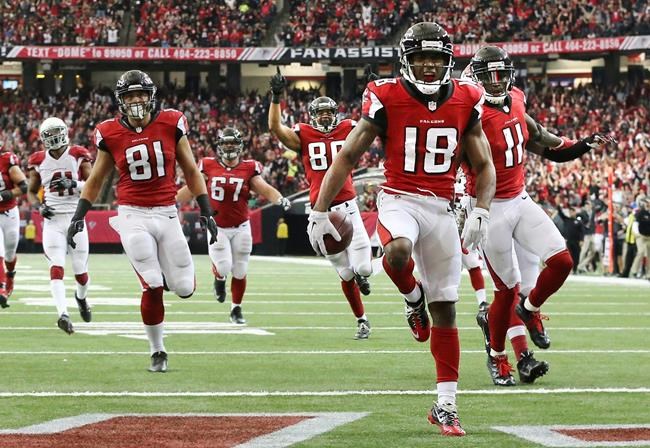 Falcons wide receiver Taylor Gabriel scores a 35-yard touchdown against the Cardinals for a 17-10 lead during the second quarter in an NFL football game on Sunday Nov. 27 2016 in Atlanta