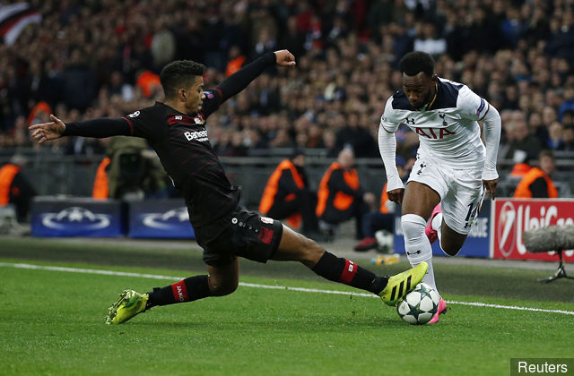 Tottenham's Georges Kevin Nkoudou in action with Bayer Leverkusen's Wendell