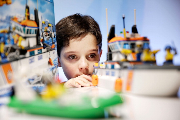 LONDON ENGLAND- NOVEMBER 06 Harry Collett  plays with a Lego Coastguard Patrol set at a media event at St Mary's Church in Marylebone