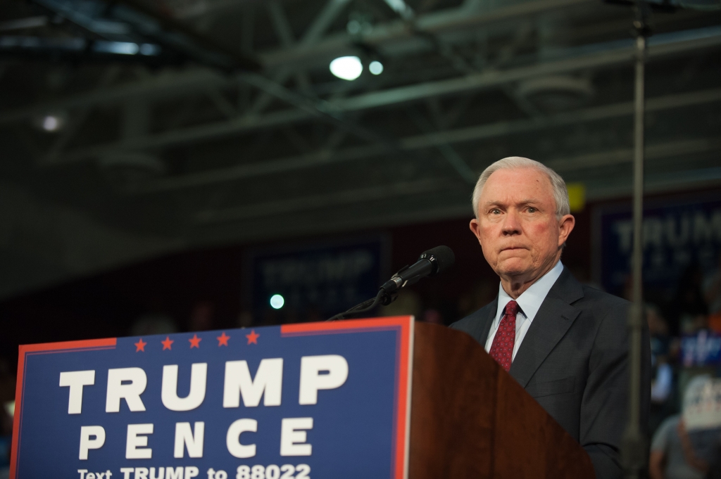 Alabama Senator Jeff Sessions pledges his commitment to Republican candidate Donald Trump before he speaks to supporters at a rally on Oct. 10 2016 in Ambridge Pennsylvania