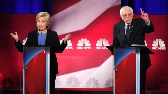 Democratic US presidential candidate Hillary Clinton and rival candidate Bernie Sanders speak simultaneously at a debate in Charleston South Carolina