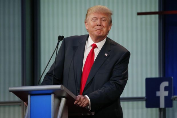 Donald Trump pauses during the first official Republican presidential debate of the 2016 election in Cleveland Ohio