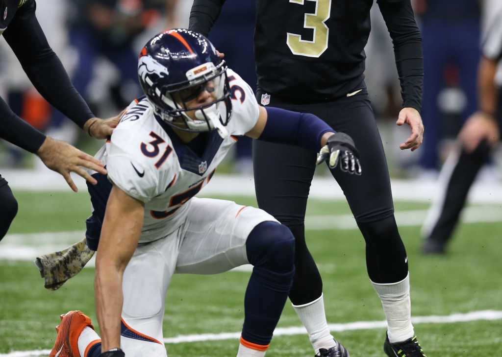 Nov 13 2016 New Orleans LA USA Denver Broncos free safety Justin Simmons, bottom after his block of a New Orleans Saints kicker Wil Lutz extra point in the fourth quarter at the Mercedes Benz Superdome. The Broncos won 25-23. Mandatory Cre