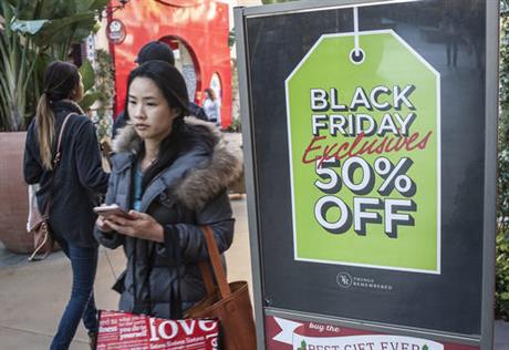 Shoppers look for deals at the Irvine Spectrum Center in Irvine Calif. on Black Friday Nov. 25 2016. Stores are trying to better cater to savvier shoppers who are splitting their spending back and forth online and in stores. That was apparent on Blac