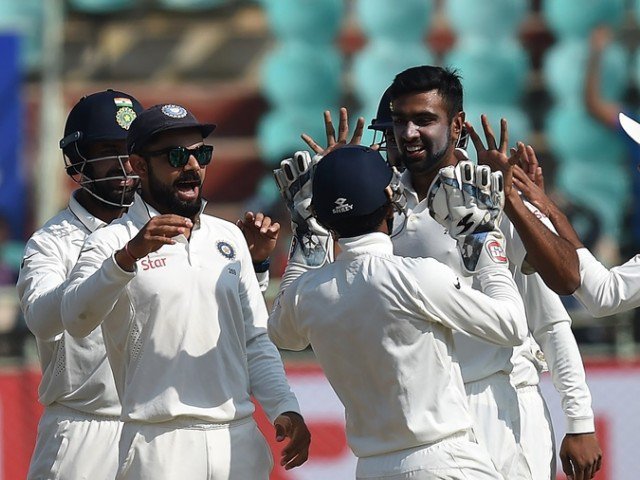 India's Ravichandran Ashwin celebrates the wicket of England's Ben Duckett with captain Virat Kohli and teammates during the last day of the second Test cricket match between India and England at the Dr. Y.S. Rajasekhara Reddy AC