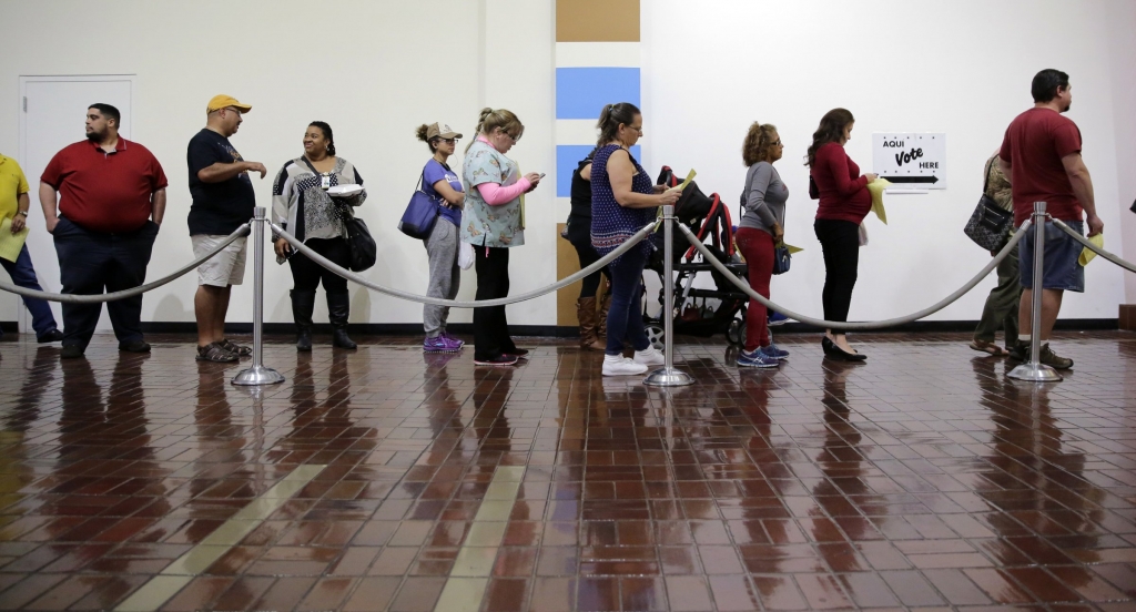 Voters wait in line to cast ballots at an early polling site on Friday Nov. 4 2016 in San Antonio. AP