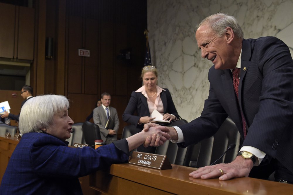 Federal Reserve Chair Janet Yellen left shakes hands with Joint Economic Committee Chairman Sen. Dan Coats R-Ind. after she testified on Capitol Hill in Washington on Thursday