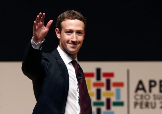 Facebook founder Mark Zuckerberg waves to the audience during a meeting of the APEC Ceo Summit in Lima Peru