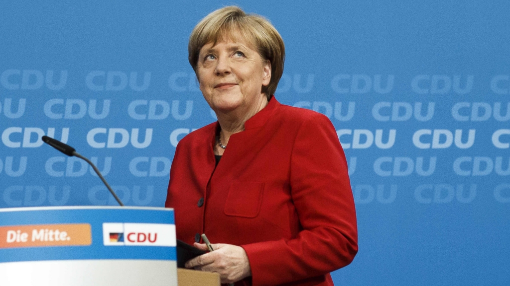 German Chancellor Angela Merkel arrives at a news conference where she announced her plan to run for a fourth term next year. Merkel is the leader of the conservative German Christian Democrats party