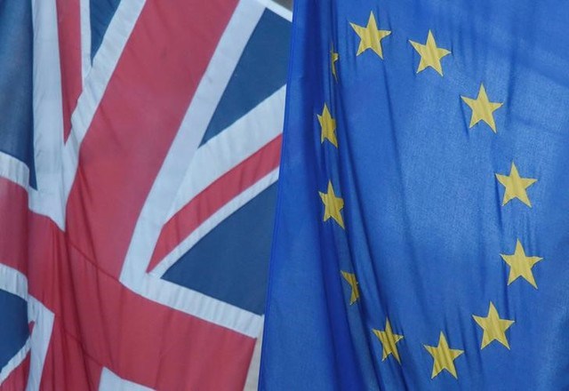 A Union flag flies next to the flag of the European Union in Westminster London Britain