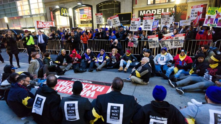 A crowd of 350 people protest in front of a McDonald's in New York for a #15 minimum wage