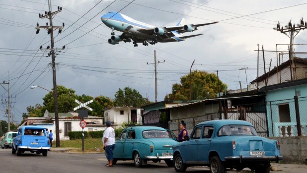 The Boeing 747 Air Force One carrying US President Barack Obama and his family flies over a neighborhood of Havana