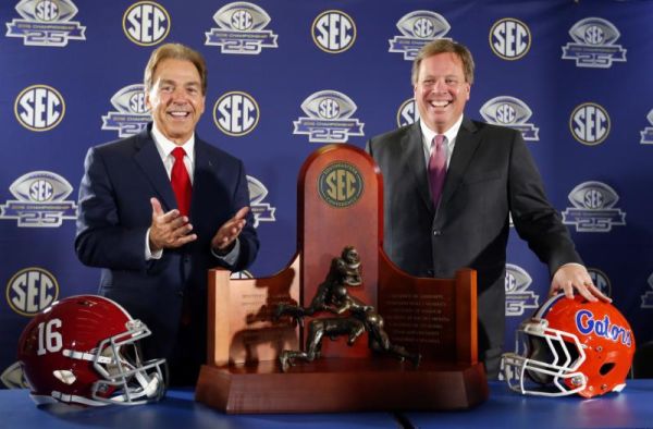 Alabama head coach Nick Saban left and Florida