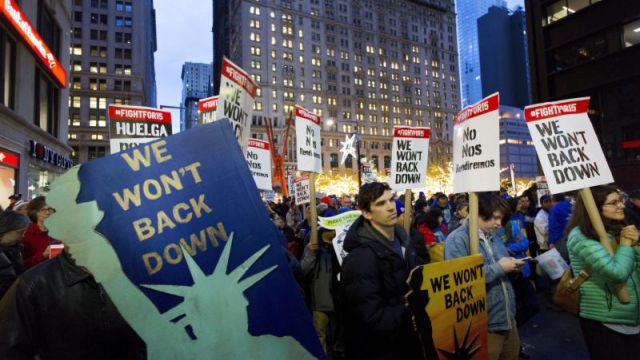 Hundreds of Chicago O'Hare airport workers go on strike over wages