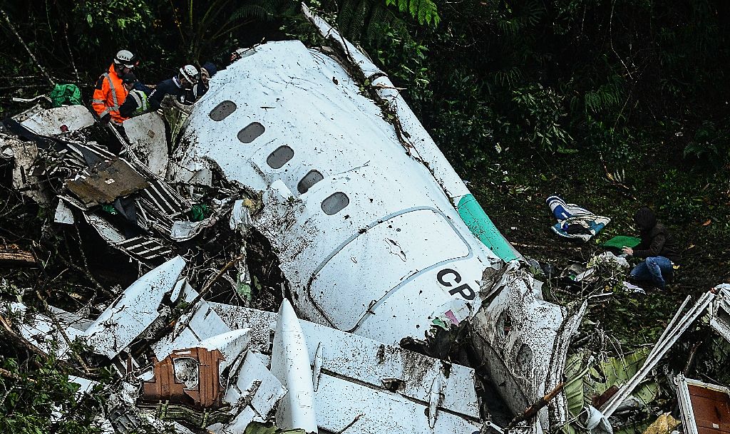 Rescuers work on recovering the bodies of victims of the LAMIA airlines charter that crashed