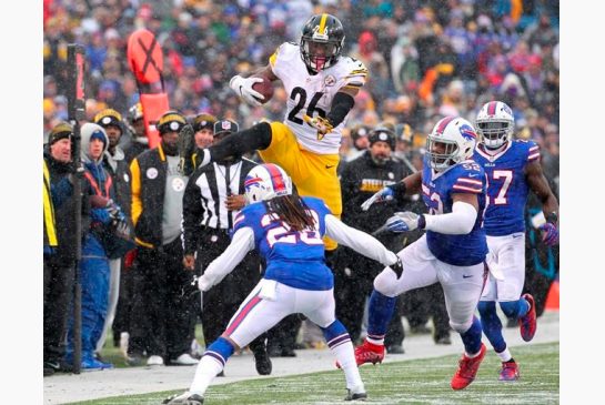 Pittsburgh Steelers running back Le'Veon Bell leaps over Buffalo Bills cornerback Ronald Darby during the second half of an NFL football game in Orchard Park N.Y. The do-everything running back has thr