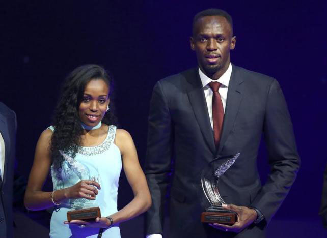 Usain Bolt of Jamaica and Almaz Ayana of Ethiopia pose with their awards after being elected male and female World Athlete of the Year 2016 in Monaco