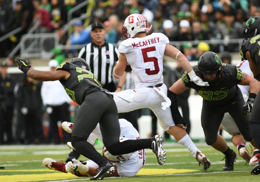 EUGENE OR- NOVEMBER 12 Stanford University RB Christian Mc Caffrey runs through the Oregon defense for a positive gain during a PAC-12 NCAA football game between the Oregon Ducks and the Stanford Cardinal