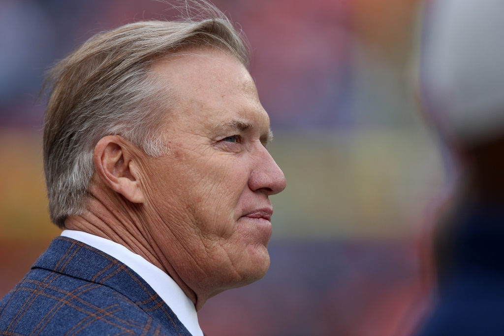 DENVER CO- OCTOBER 04 John Elway General Manaher and Executive Vice President of Football Operations for the Denver Broncos looks on as the team warms up to face the Minnesota Vikings at Sports Authority Field at Mile High