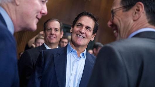 Mark Cuban center Chairman of AXS TV talks with Senate Majority Whip John Cornyn R-Texas left and Randall Stephenson right CEO of AT&T before a Senate Judiciary Subcommittee on Antitrust Competition Policy & Consumer Rights hearing in Dirksen Bu