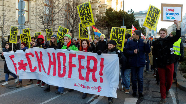 Protesters holding posters that read “No Nazi inside Hofburg palace” demonstrate against Austrian presidential candidate Norbert Hofer in Vienna Austria Dec. 3 2016