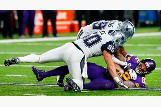 Minnesota Vikings tight end Kyle Rudolph catches a pass under Dallas Cowboys defenders Sean Lee and Anthony Hitchens rear during the first half of an NFL football game Thursday Dec. 1 2016 in Minneapolis