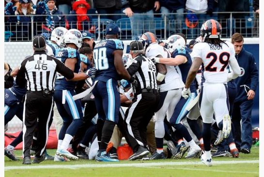 Tennessee Titans and Denver Broncos players push and shove during a scuffle in the first half of an NFL football game Sunday Dec. 11 2016 in Nashville Tenn