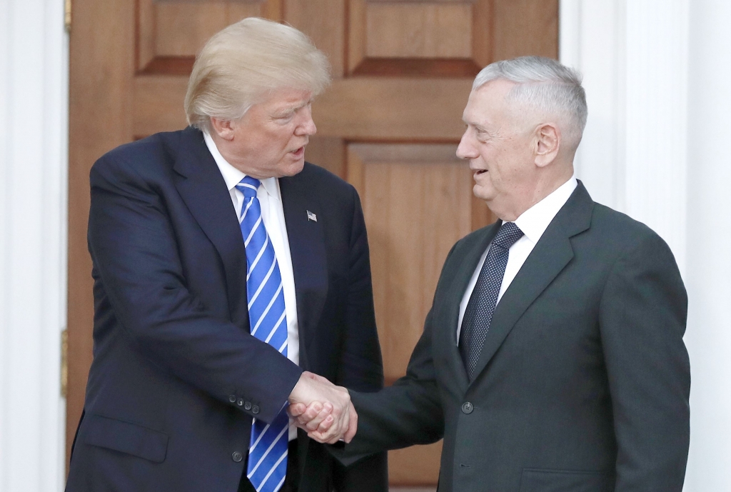 President-elect Donald Trump shakes hands with retired Marine Corps Gen. James Mattis as he leaves Trump National Golf Club Bedminster clubhouse in Bedminster N.J