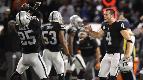 Derek Carr celebrates with D.J. Hayden following the win