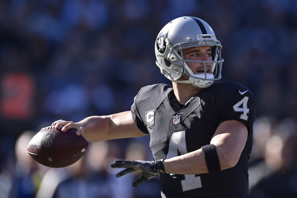 Oakland Raiders quarterback Derek Carr throws a pass against the Indianapolis Colts in the first quarter of their NFL game at the Coliseum in Oakland Calif. on Saturday Dec. 24 2016