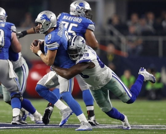 Detroit Lions quarterback Matthew Stafford is sacked by Dallas Cowboys defensive end Benson Mayowa in the second half Monday in Arlington Texas