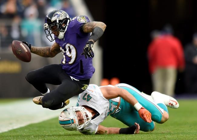 Baltimore Ravens wide receiver Steve Smith top falls over Miami Dolphins middle linebacker Kiko Alonso as he rushes the ball in the second half of an NFL football game Sunday Dec. 4 2016 in Baltimore