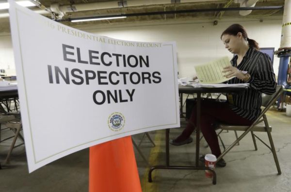 Nicole Kirby looks over results during a statewide