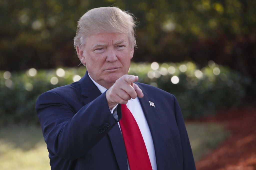 Republican presidential candidate Donald Trump points towards guests during an campaign event with employees at Trump National Doral Tuesday Oct. 25 2016 in Miami