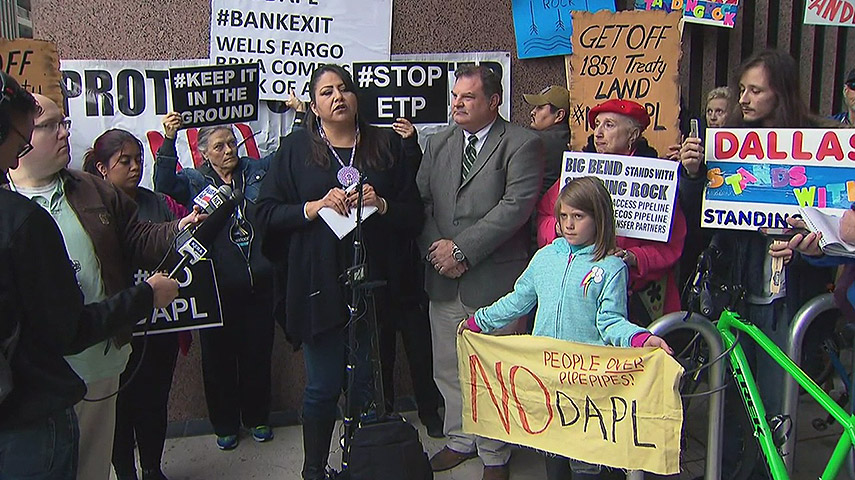 Activist Yolanda Bluecloud talks to supporters during a press conference in downtown Dallas'Why not just reroute this pipeline? How many people – veterans who laid down their lives – are you willing to risk? Why not just do the right thing and keep