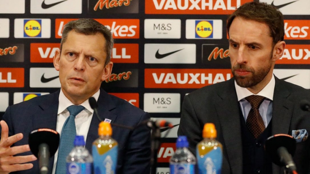 Martin Glenn left chief executive of the English Football Association speaks to the media along side Gareth Southgate the newly confirmed England soccer team manager during a press conference in the headquarters of the English FA at Wembley stadium Lon