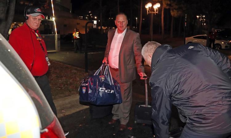 Gerard Gallant loads his bags into a taxi after being fired by the Panthers Sunday night