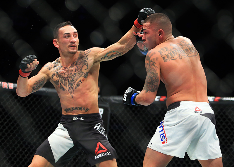 Max Holloway throws a punch at Anthony Pettis in UFC 206 at the Air Canada Centre in Toronto on Dec. 10 2016