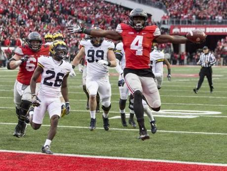 Running back Curtis Samuel scored the winning touchdown in the second overtime as Ohio State beat Michigan on Saturday