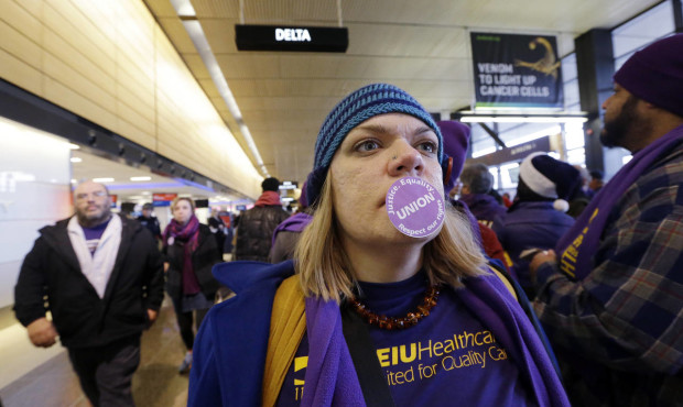 Hundreds of Chicago O'Hare airport workers go on strike over wages