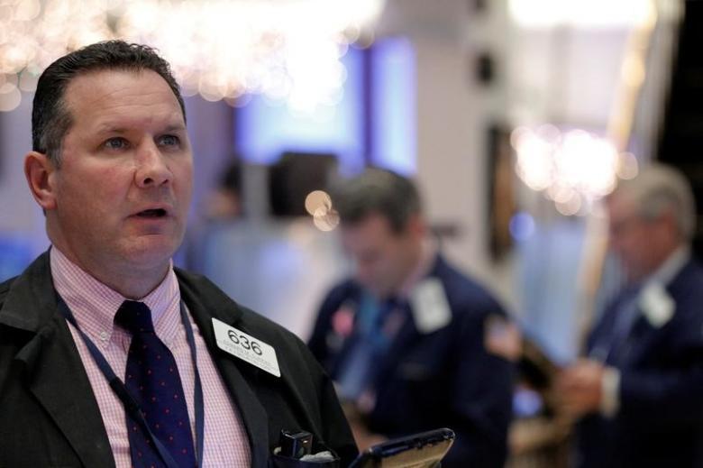 Traders work on the floor of the NYSE