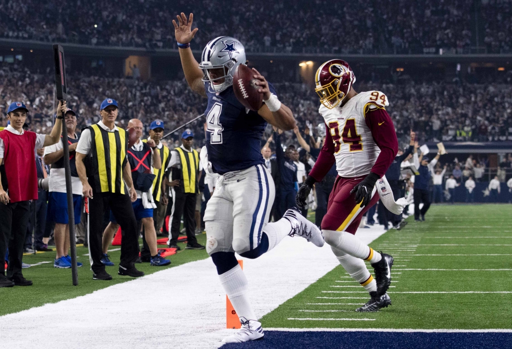 Nov 24 2016 Arlington TX USA Dallas Cowboys quarterback Dak Prescott eludes Washington Redskins outside linebacker Preston Smith for a touchdown during the second half at AT&T Stadium. Mandatory Credit Jerome Miron-USA TODAY Sports